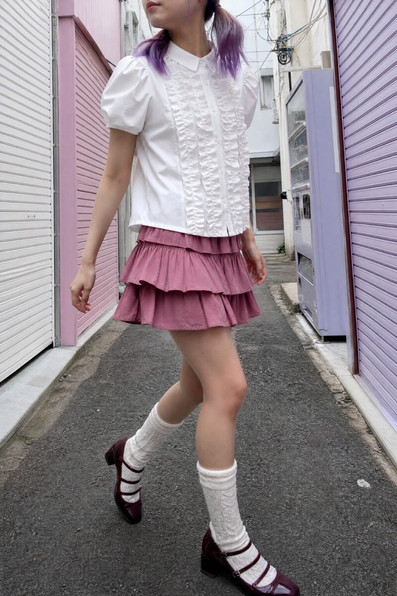 Alley Bloom Ruffle Shirt — Short puff sleeves and a double ruffle running down each side of the placket.